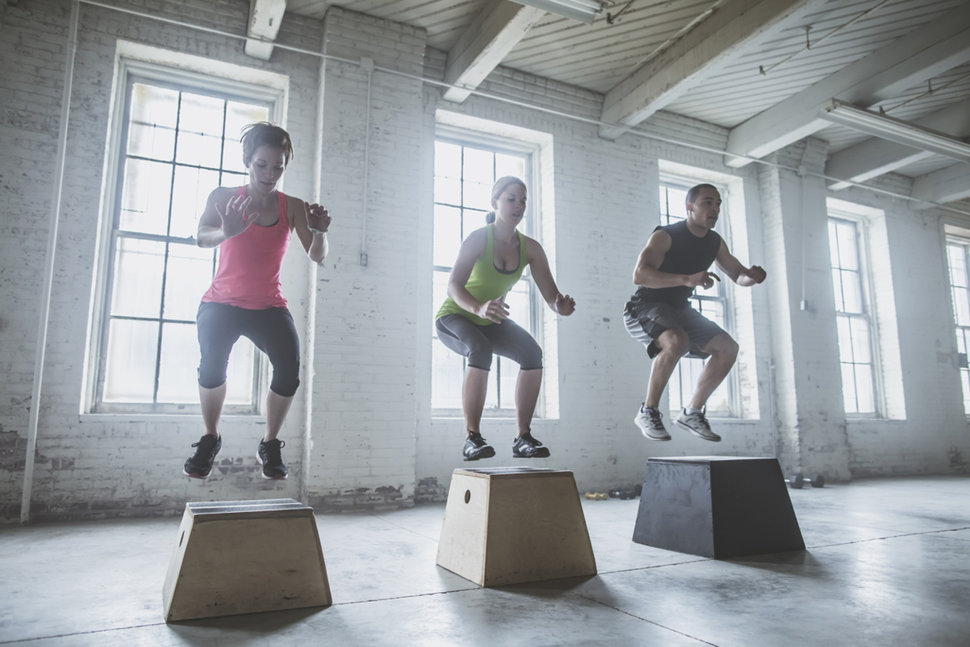 athletes working out in warehouse